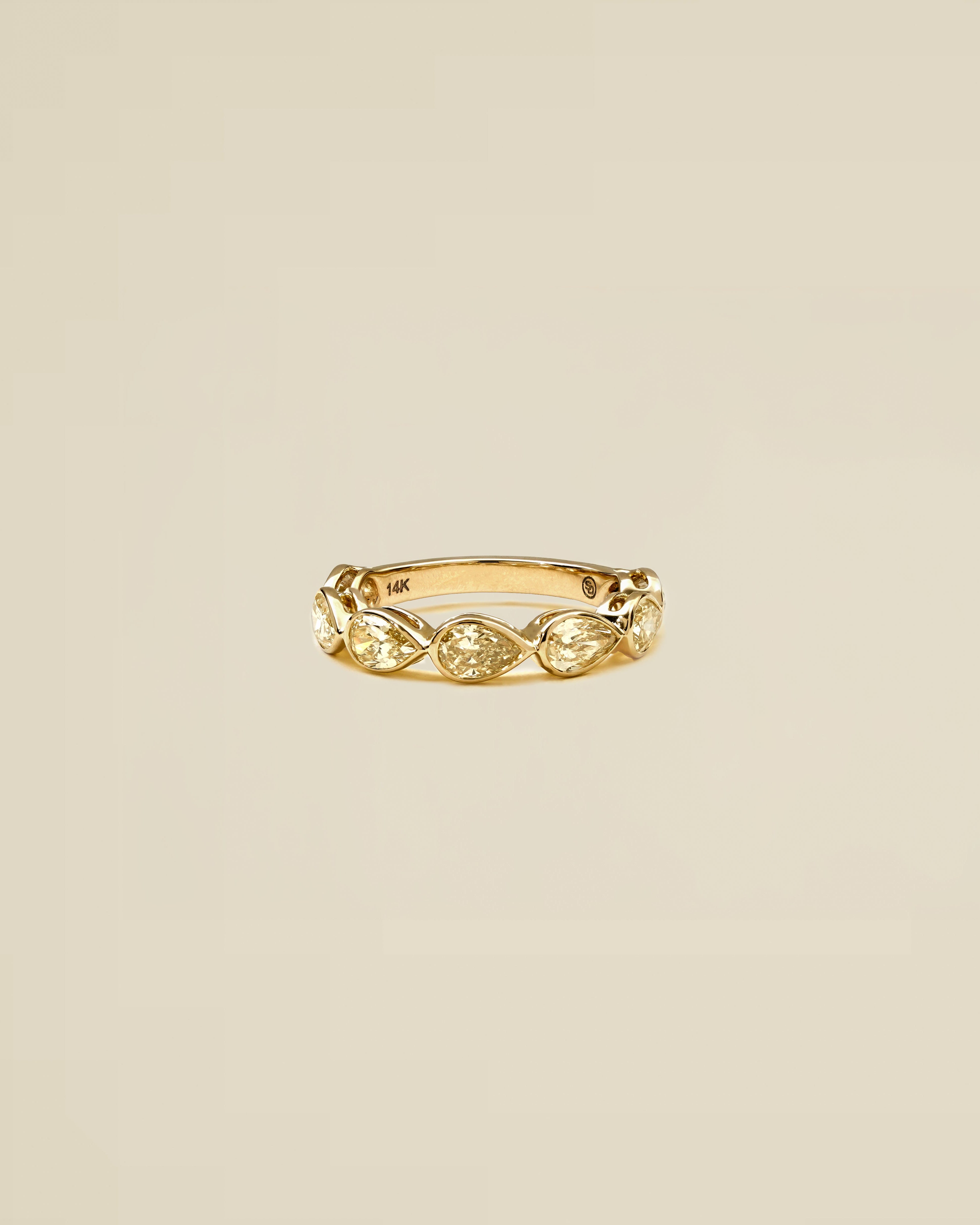 The Reserve 30 Pointer Champagne Pear Cut Diamond with Bezel Half Eternity Ring