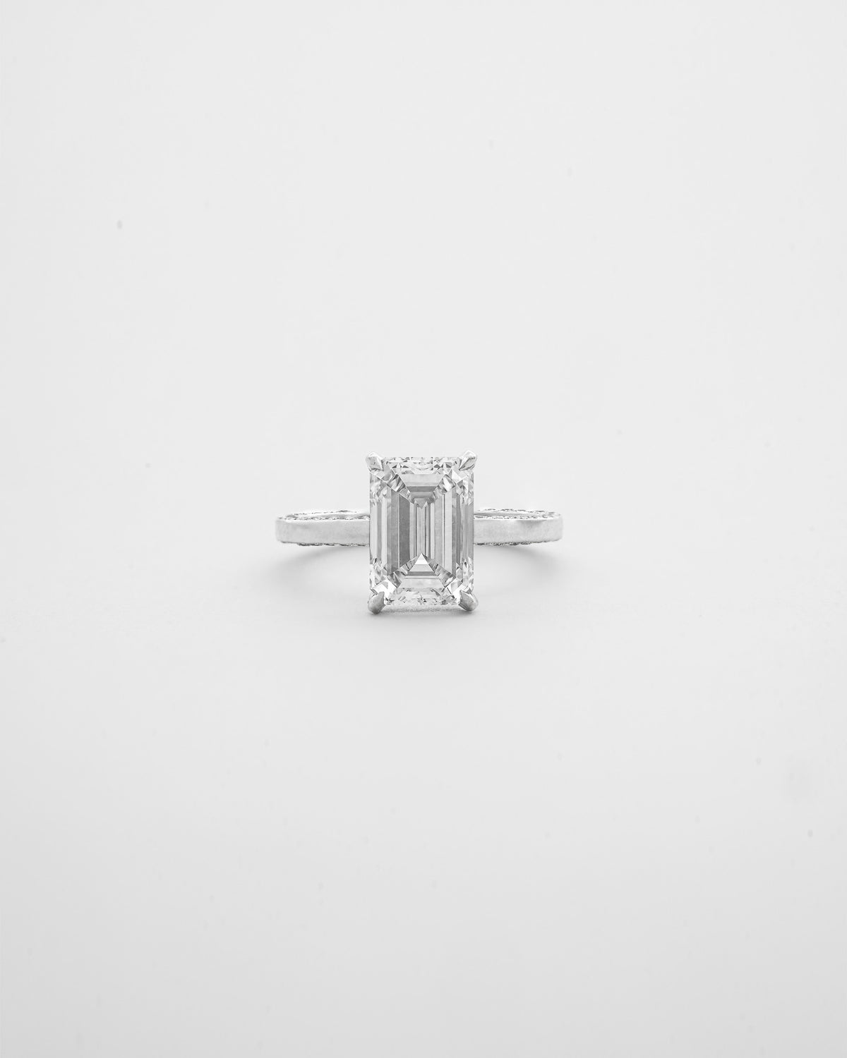 3 carats Emerald Cut Diamond with Two sided Pave Solitaire Ring