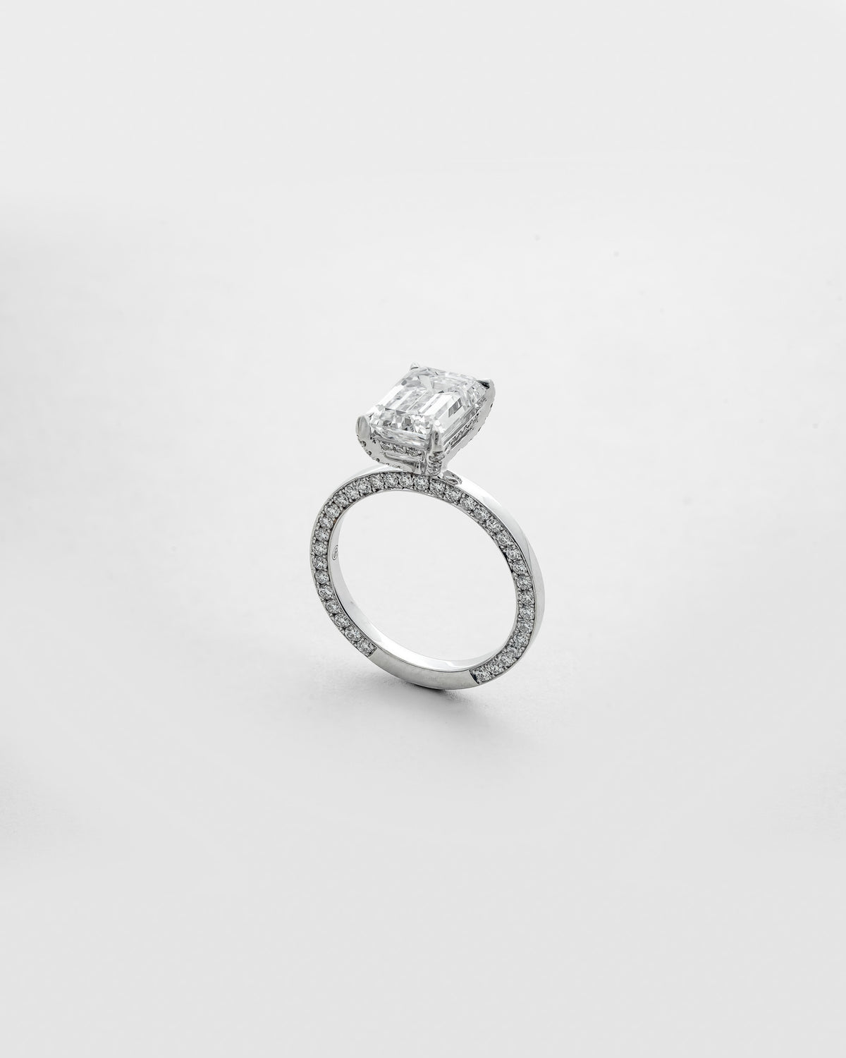 3 carats Emerald Cut Diamond with Two sided Pave Solitaire Ring