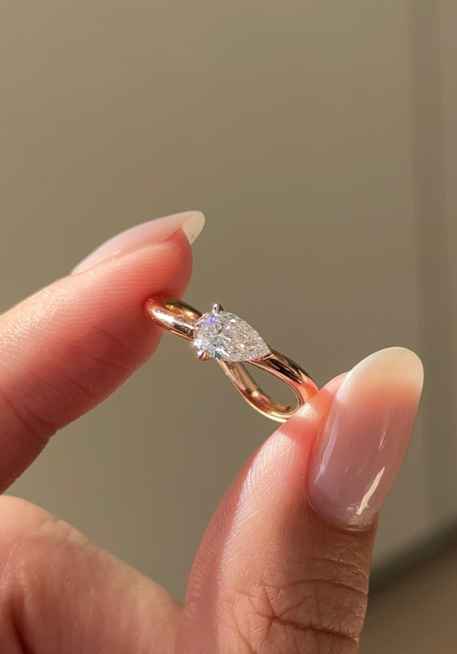 Half Carat Pear Cut Diamond Curvy Ring