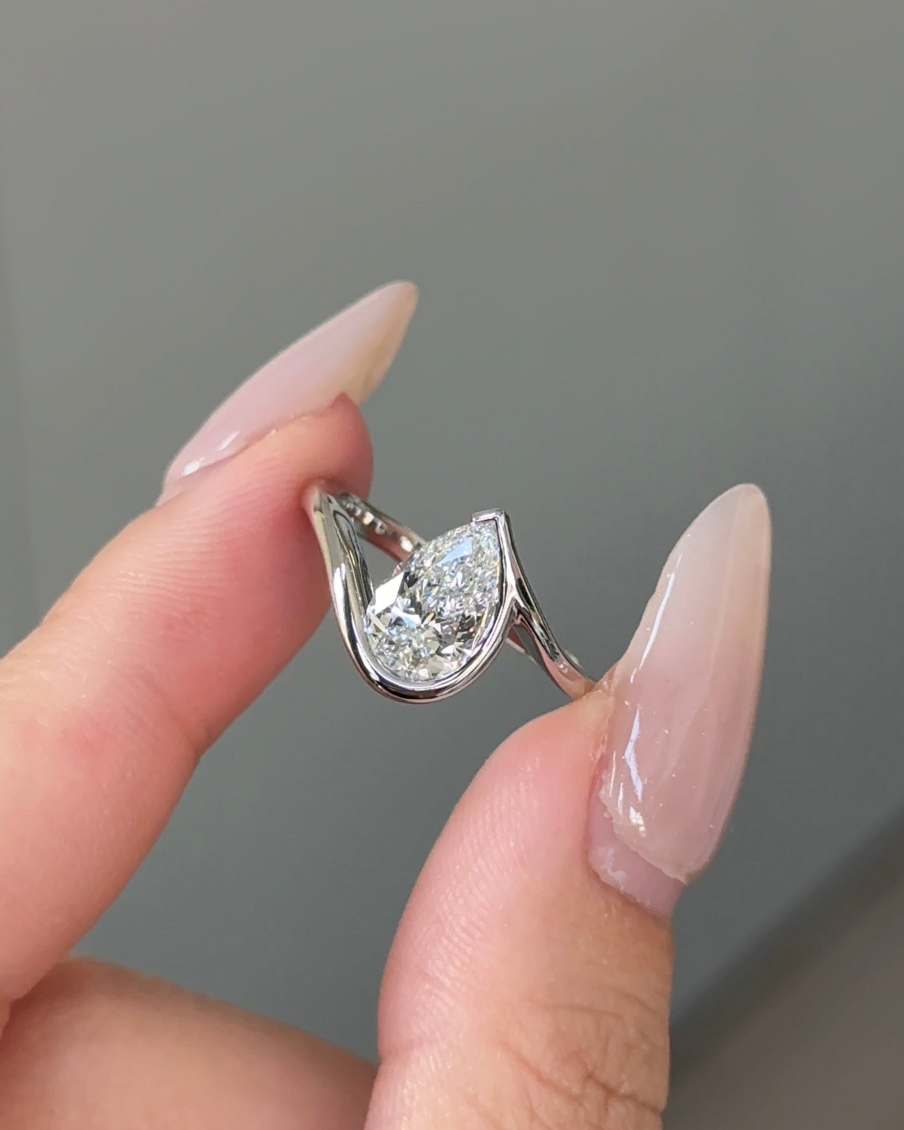 1.5 carats Pear Cut Diamond Bezel Ring