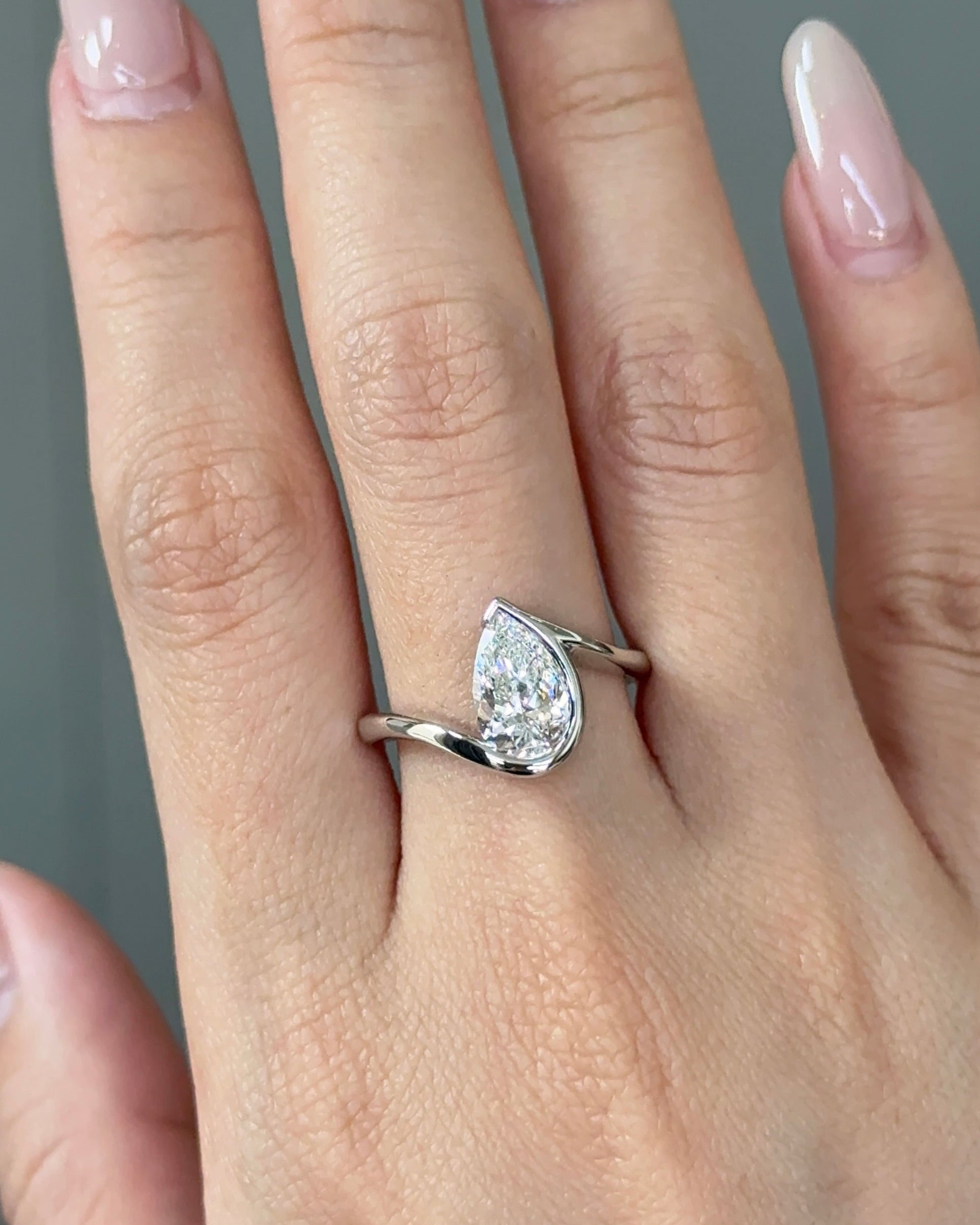 1.5 carats Pear Cut Diamond Bezel Ring