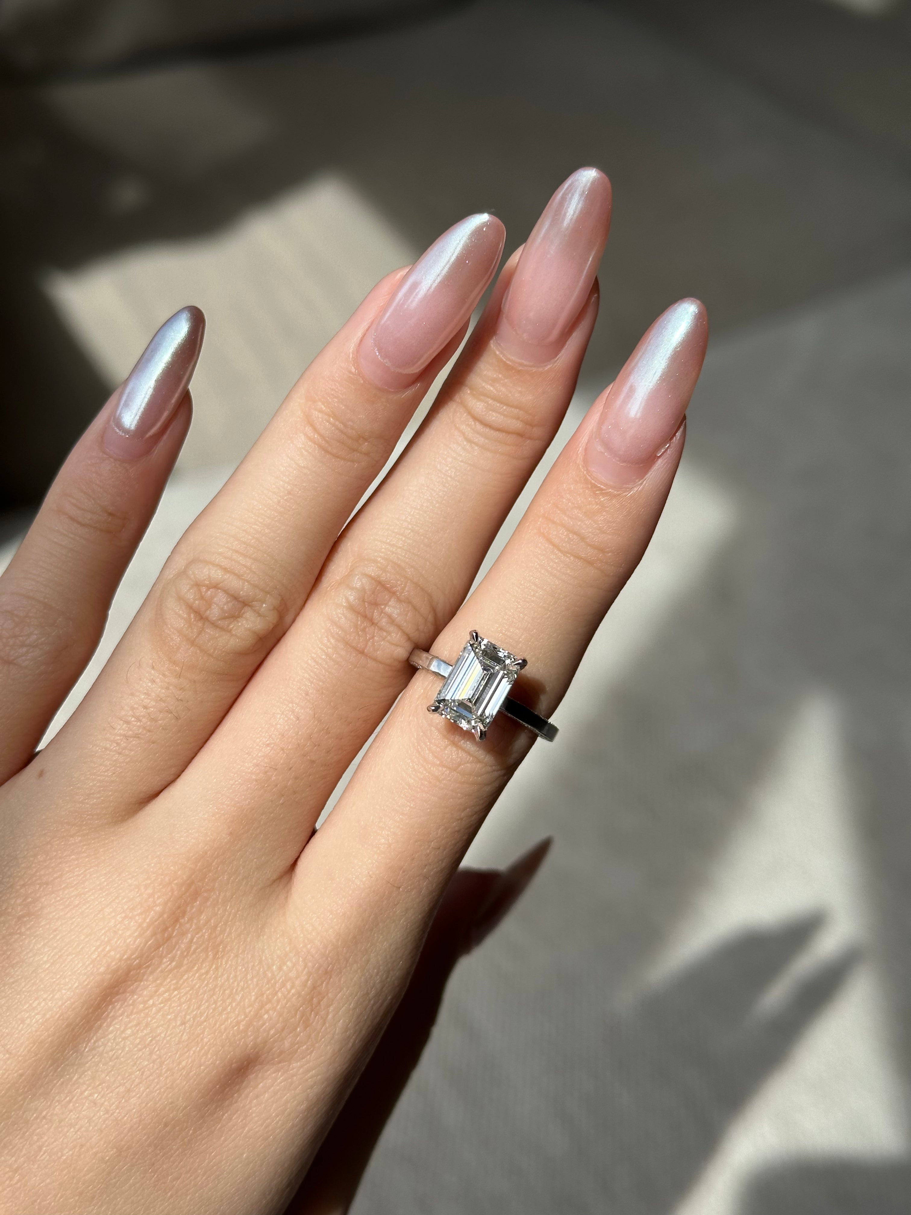 3 carats Emerald Cut Diamond With Two Sided Pave Ring