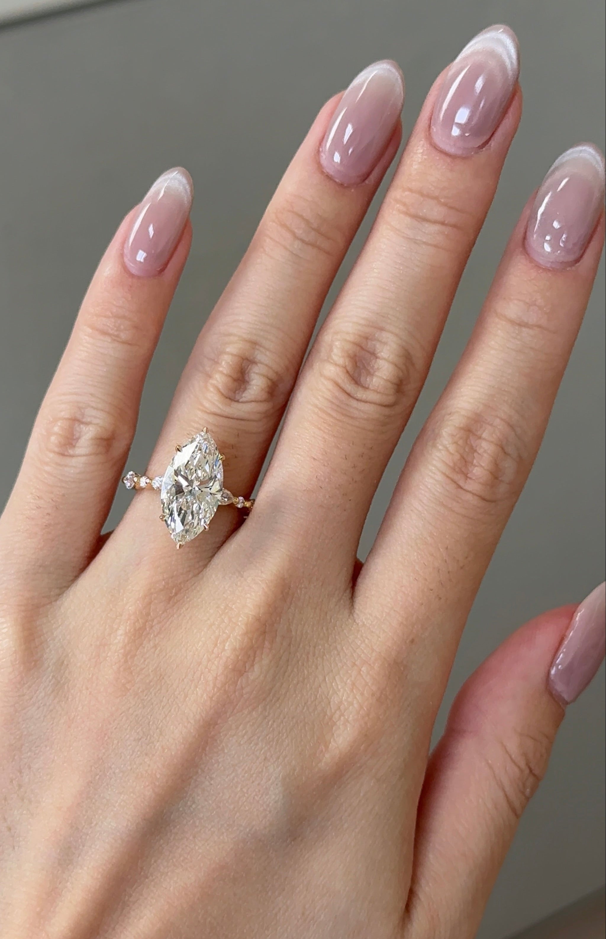 4 carats Marquise cut with Round and Marquise Accent Stones