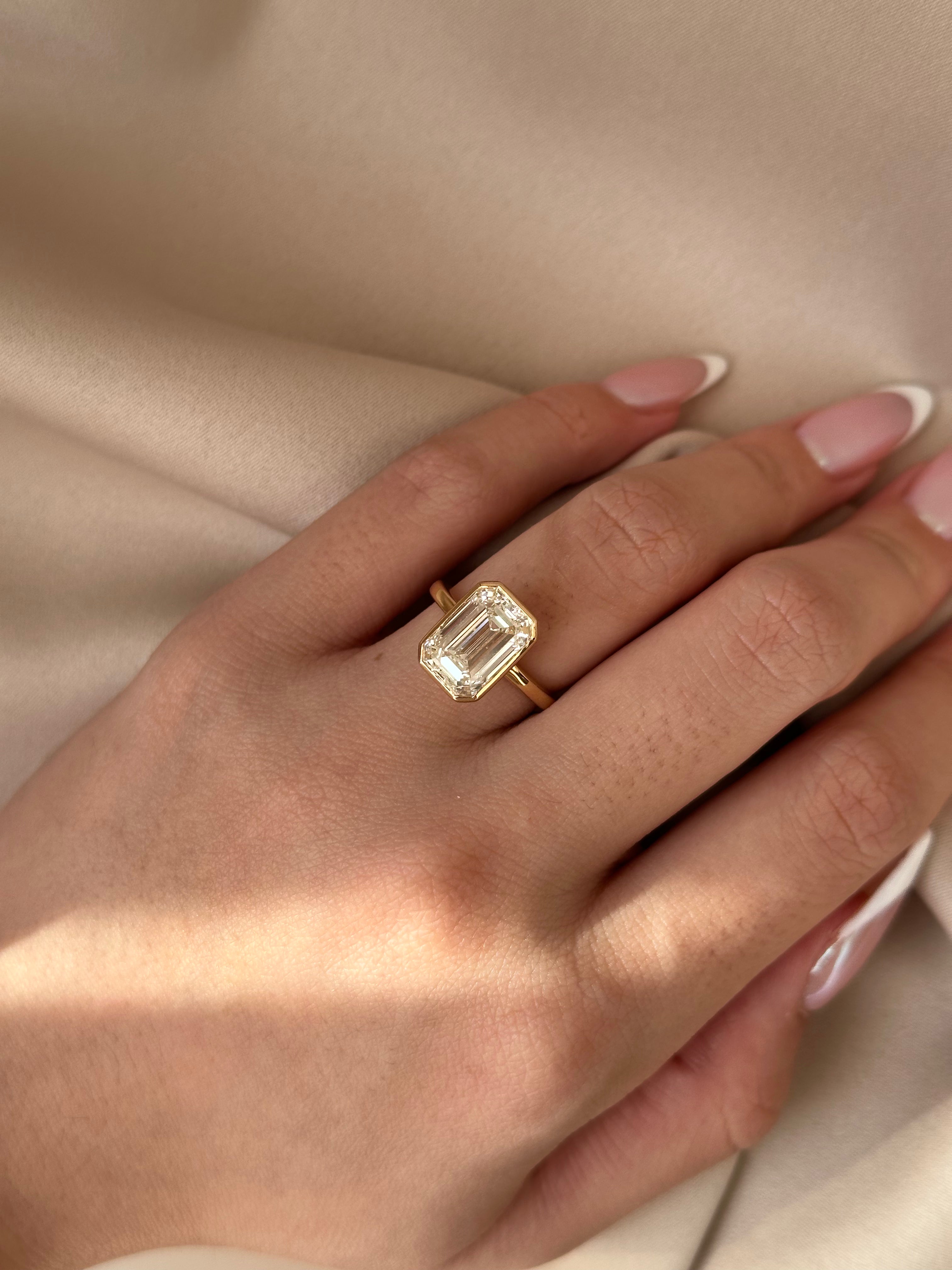 4 Carats Emerald Cut Bezel Set Diamond Ring