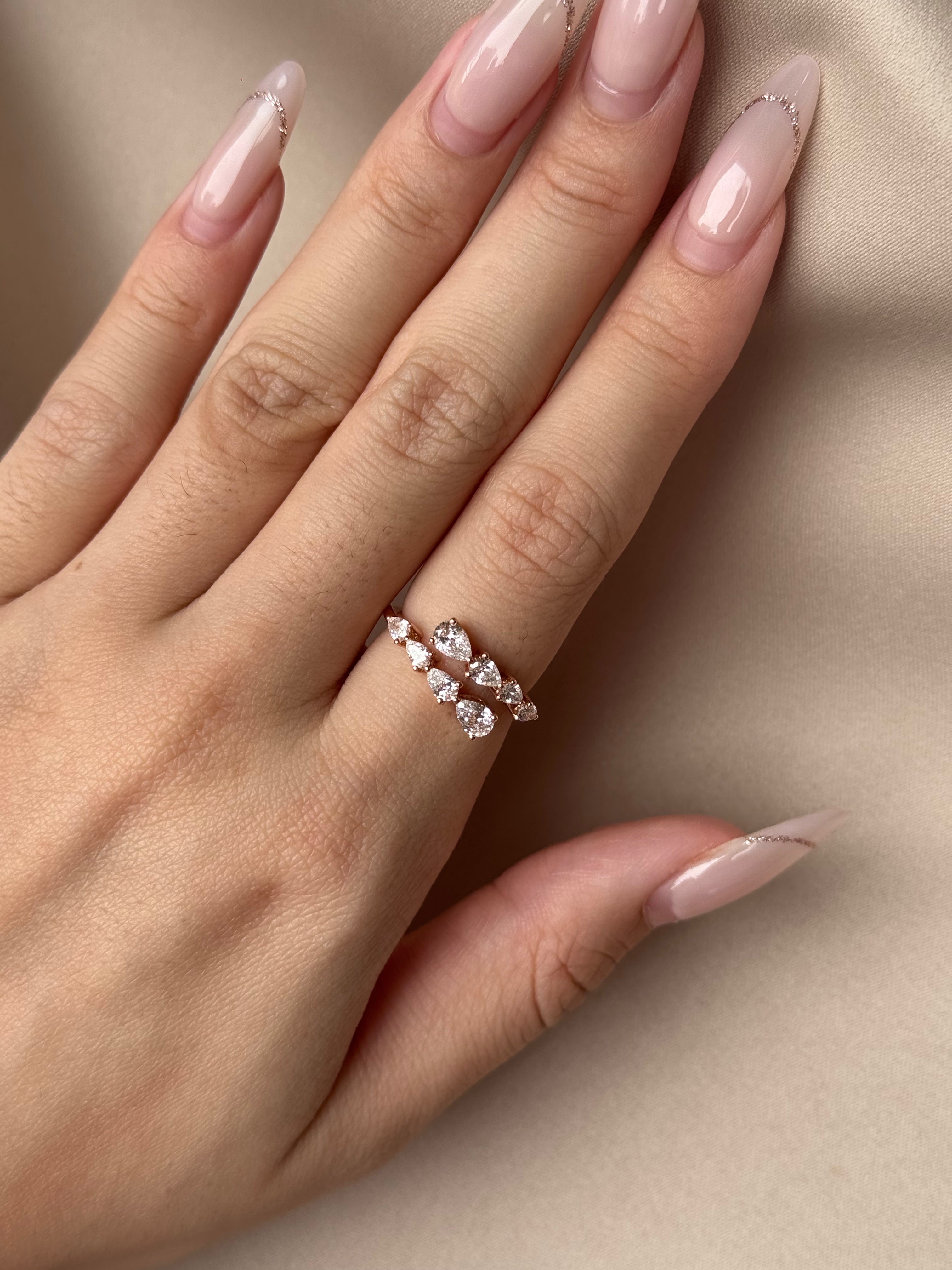 Graduated Pear Cut Diamond Open Ring