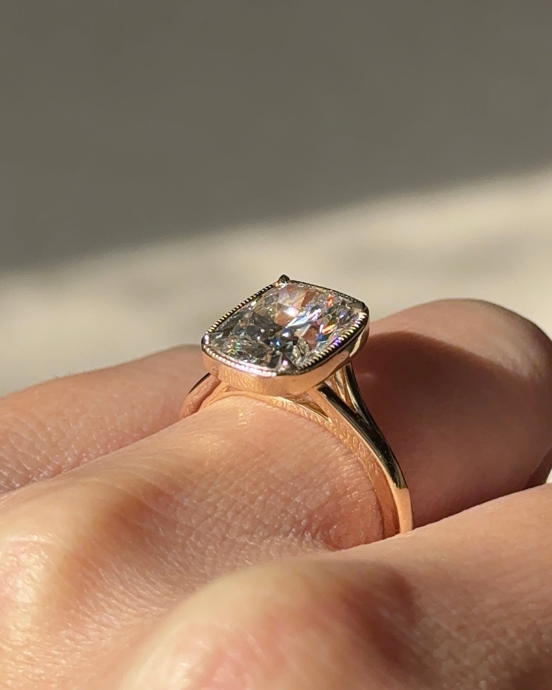 3.10 carats Elongated Cushion cut Tapered band with slim bezel ring