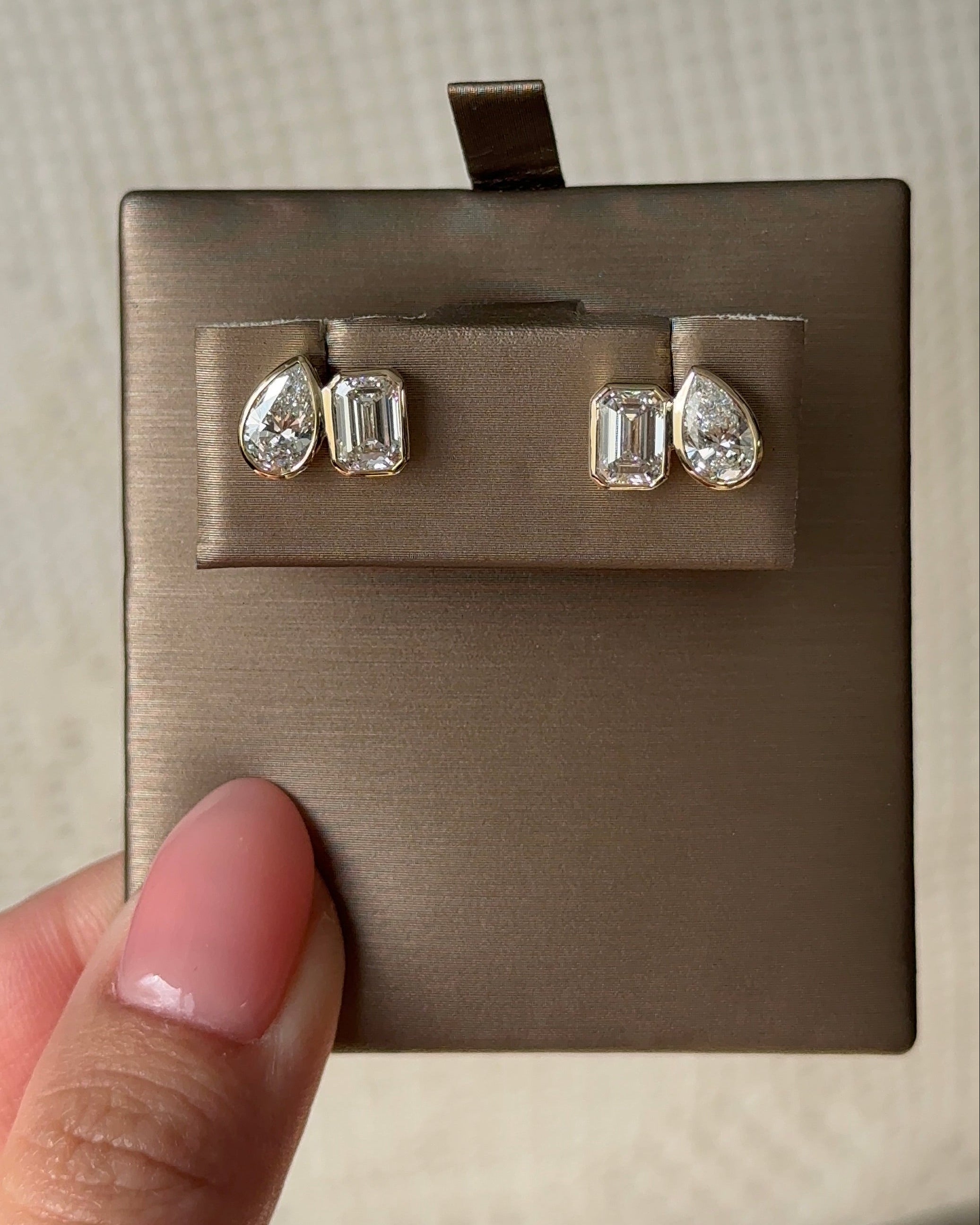 50 and 70 Pointer Emerald and Pear cut Diamond Toi Et Moi Stud Earrings in Bezel Petite Setting (with Comfort Fit Backing)