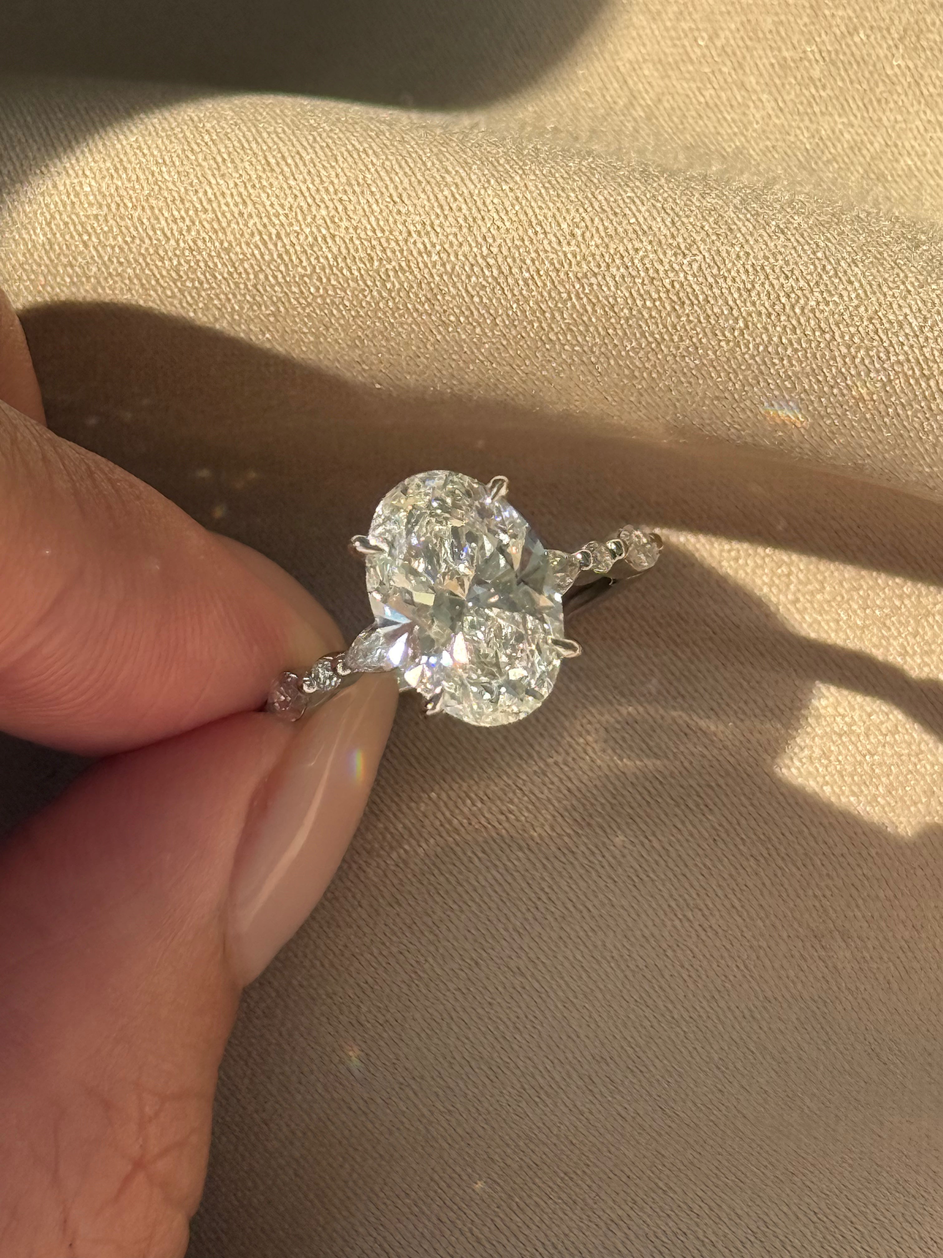 RINA Ring 3 carats Oval Diamond with Marquise and Round Band