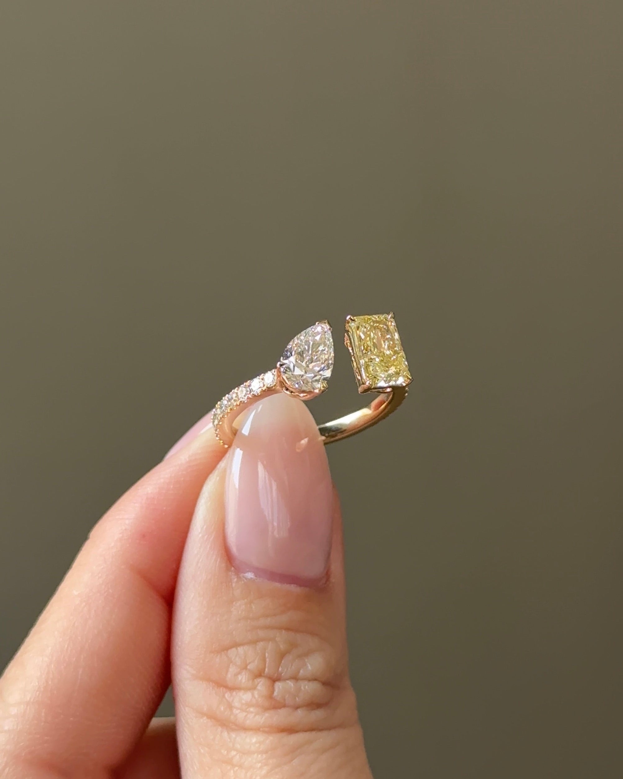 The Reserve 1 Carat Fancy Yellow Radiant and 70 Pointer Pear Cut Diamond Cuff Ring