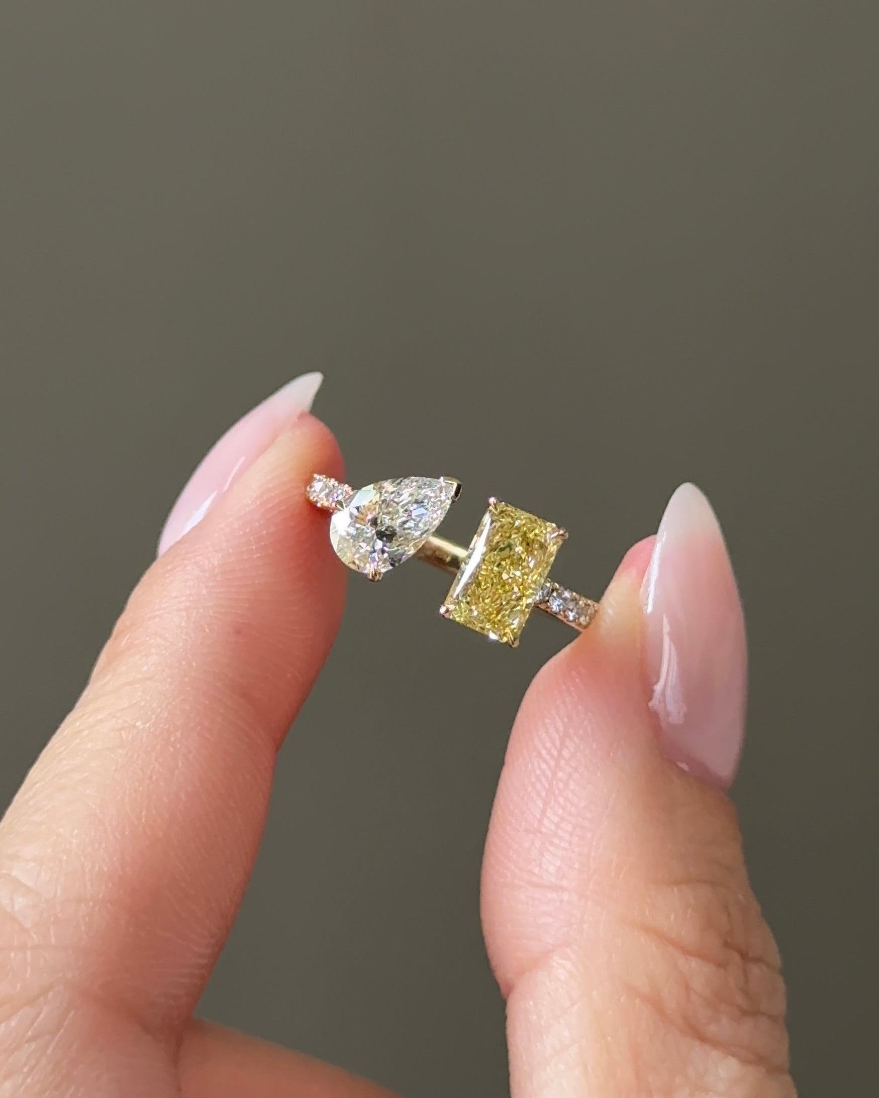 The Reserve 1 Carat Fancy Yellow Radiant and 70 Pointer Pear Cut Diamond Cuff Ring