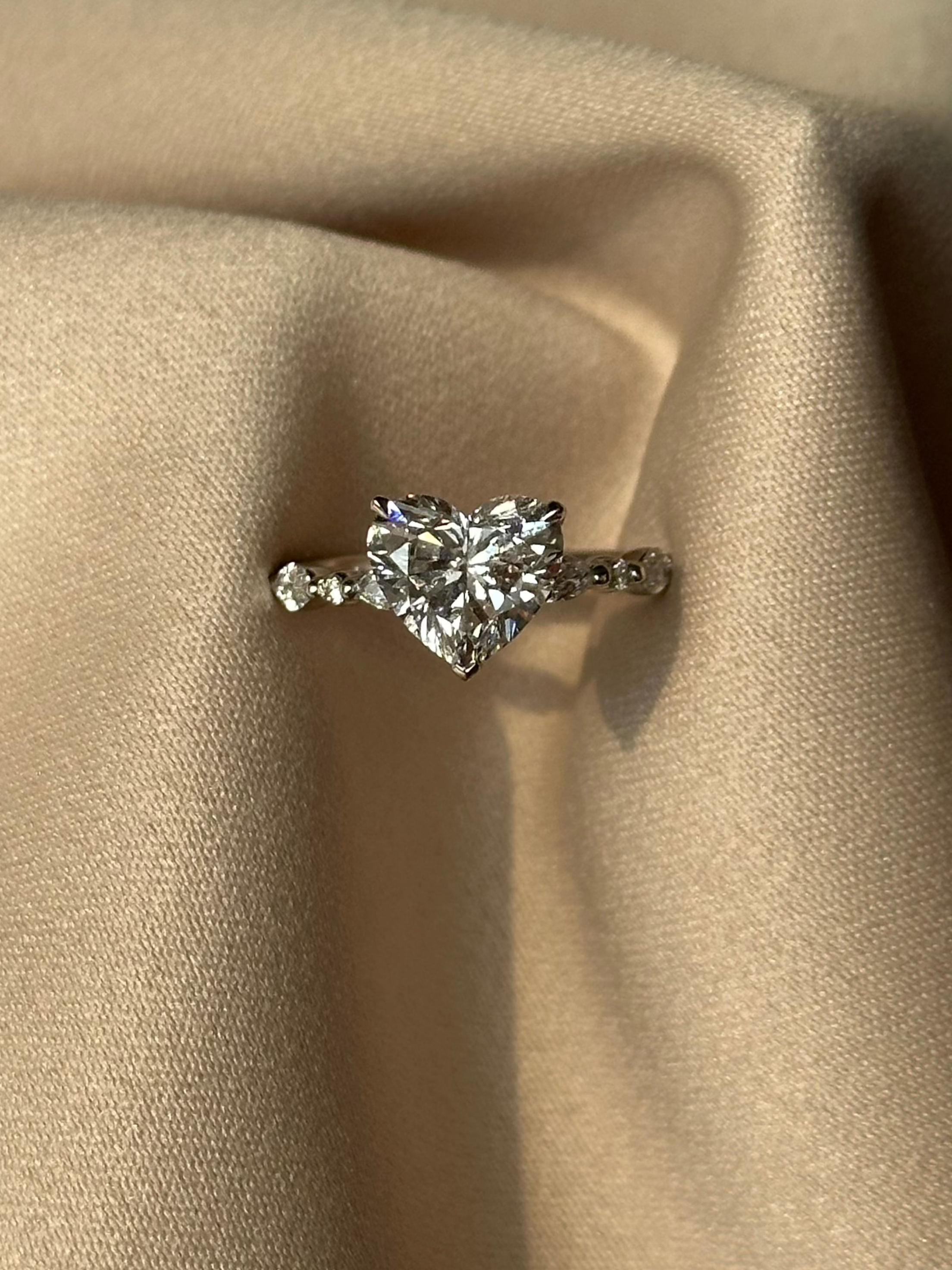 2 carats Heart cut Diamond with Marquise and Round Accent Stone Setting