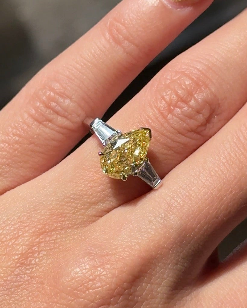 The Reserve 2.5 Carat Fancy Yellow Pear Cut Diamond with Tapered Cut Three Stone Ring