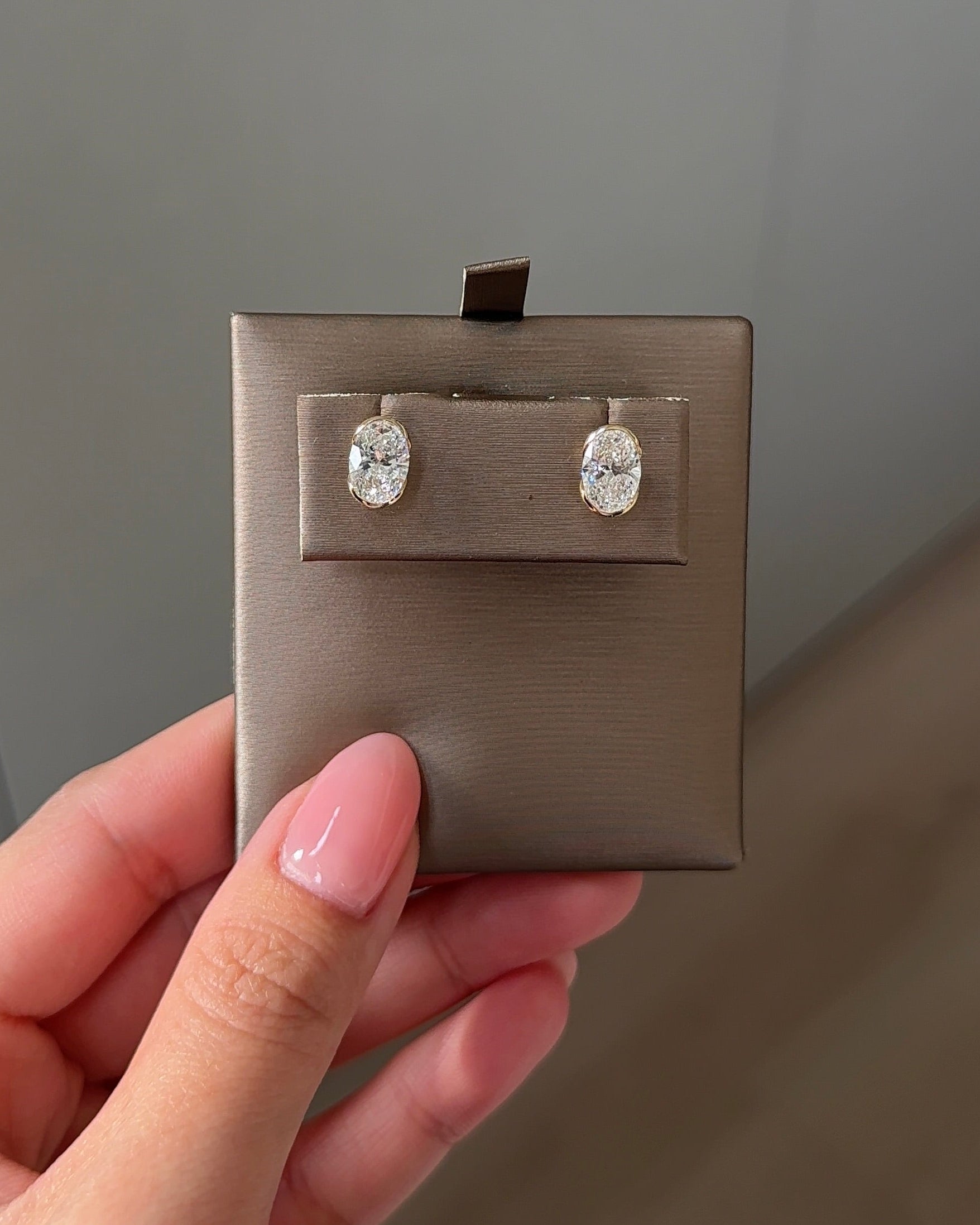 1 Carat Oval Diamond Stud Earrings in Bezel Arc Setting (with Comfort Fit Backing)