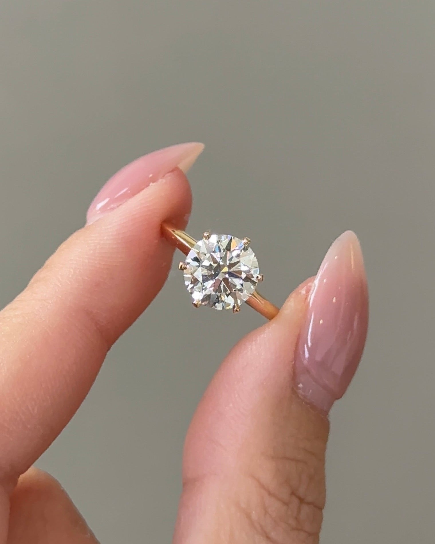 2 carats Round Cut Diamond Solitaire Ring with Knife Edge Band in Yellow Gold