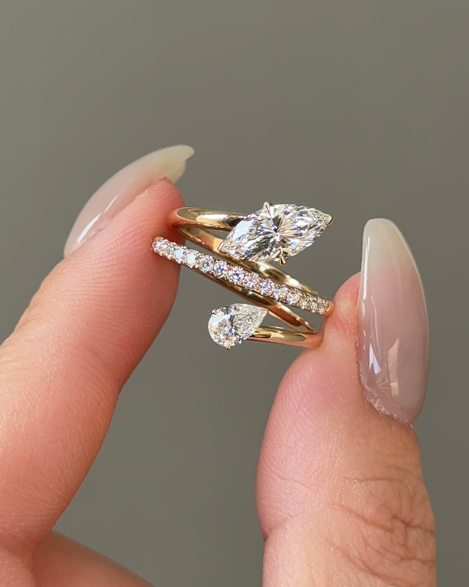 1 carats Marquise and 30 Pointer Pear cut Diamond Twist Pavé Ring