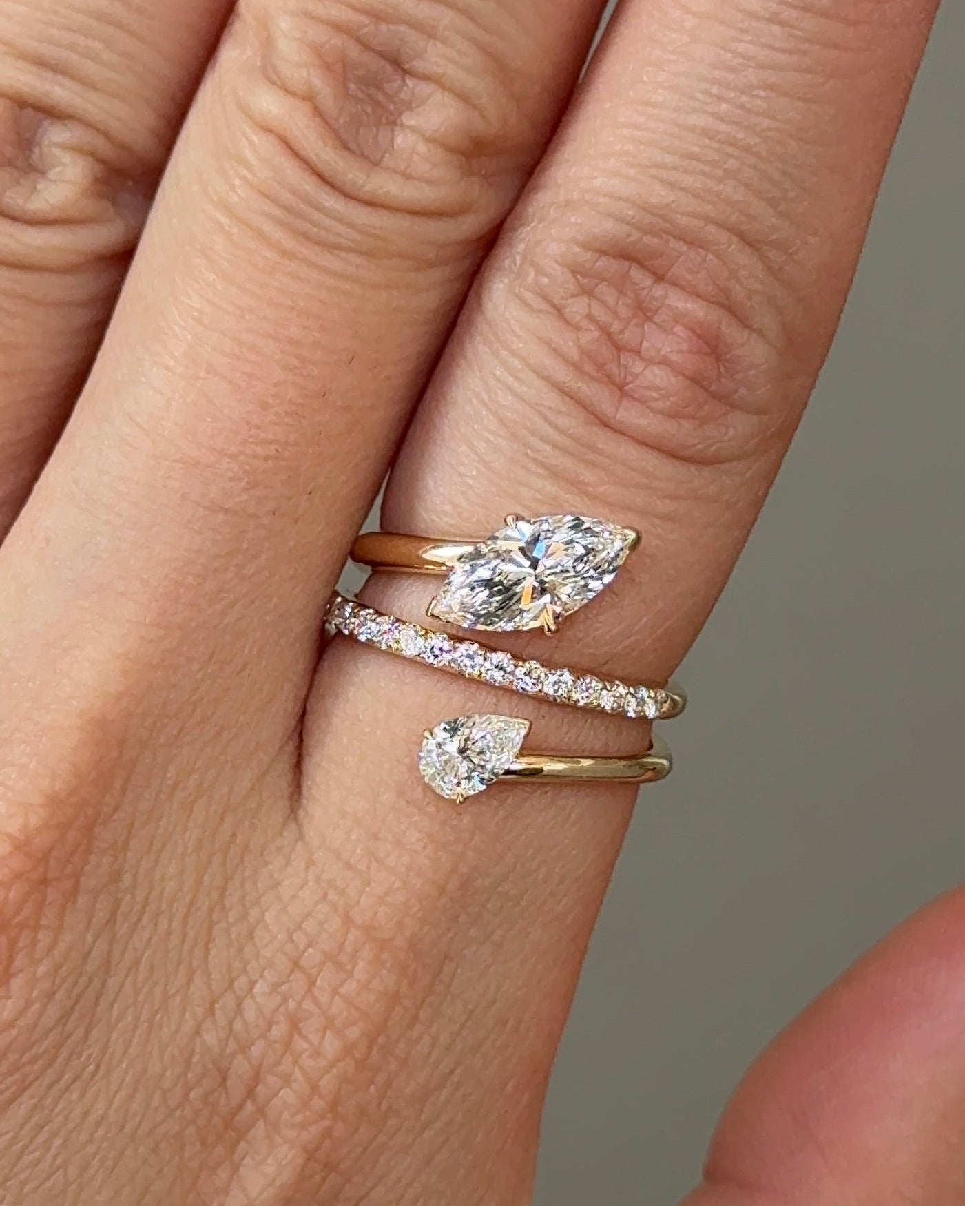 1 carats Marquise and 30 Pointer Pear cut Diamond Twist Pavé Ring