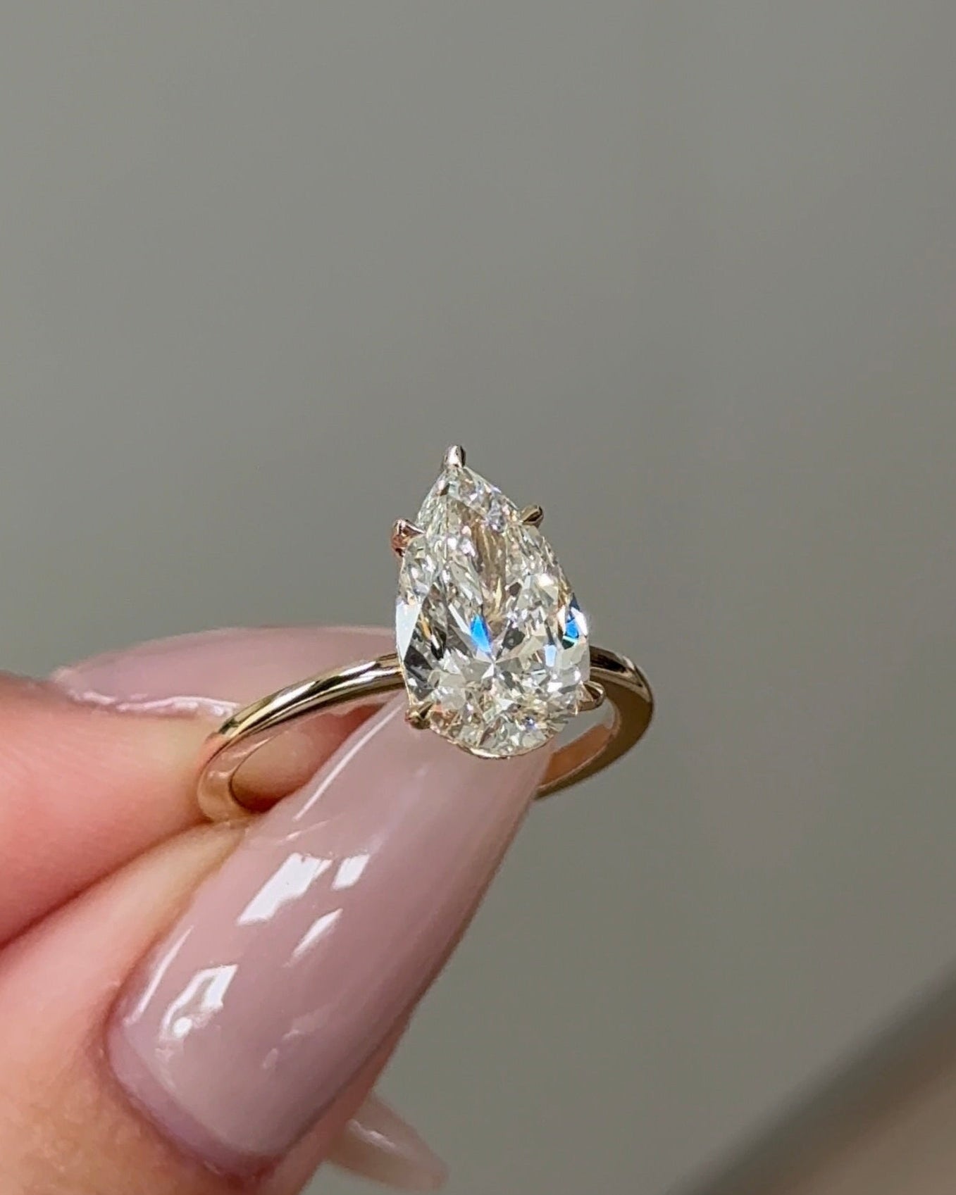 2.5 Carats Pear Cut Diamond Solitaire with Hidden Halo Setting