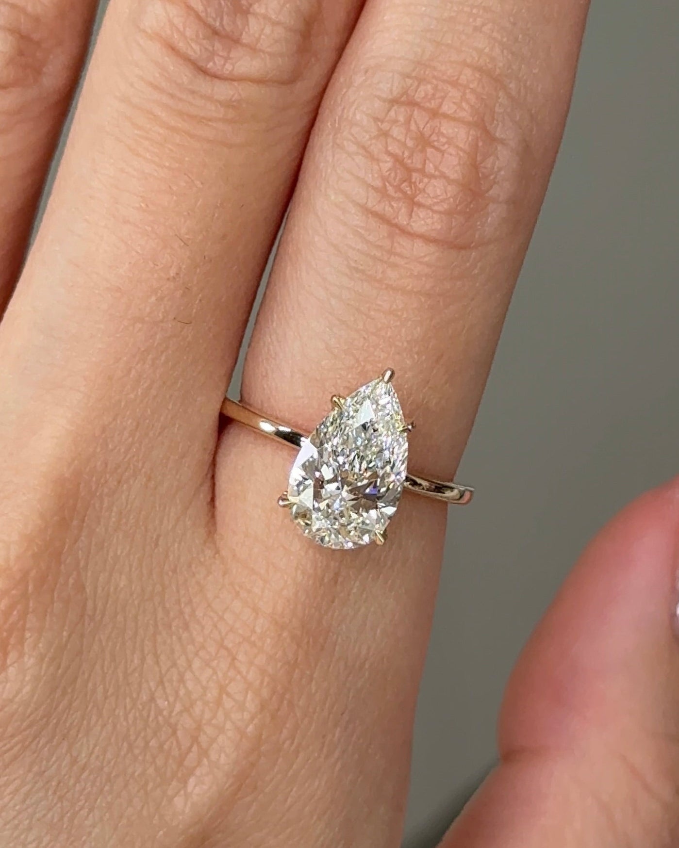 2.5 Carats Pear Cut Diamond Solitaire with Hidden Halo Setting