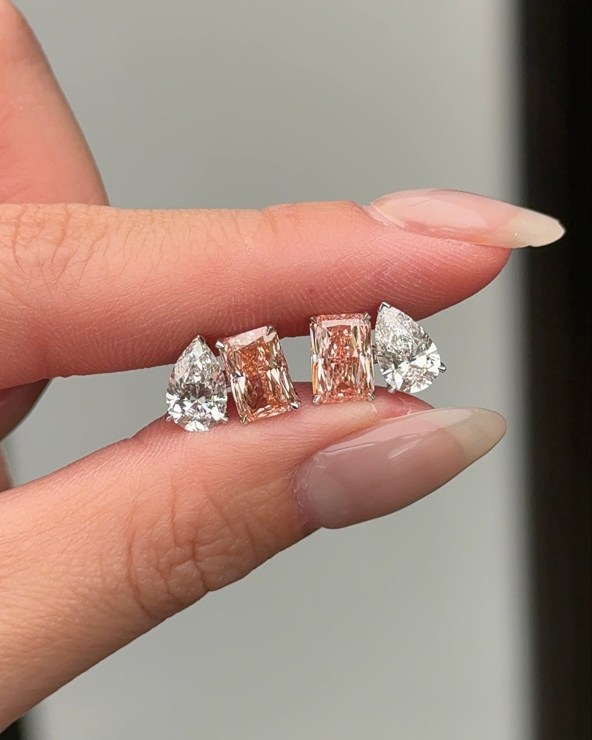 The Reserve II Toi Et Moi Pink 1.5 carats Radiant and 1 carat Pear Cut Diamond Stud Earrings