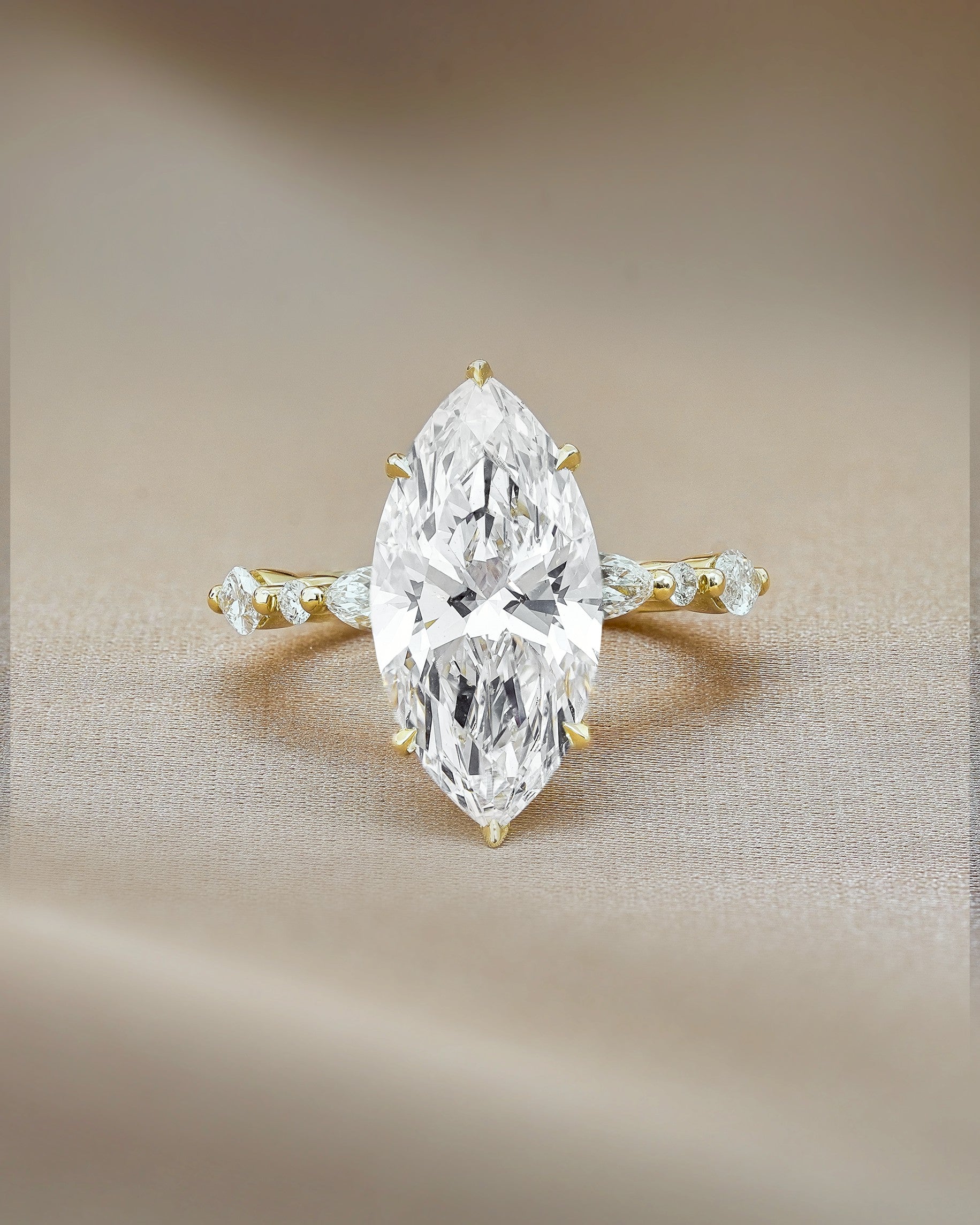 4 carats Marquise cut with Round and Marquise Accent Stones