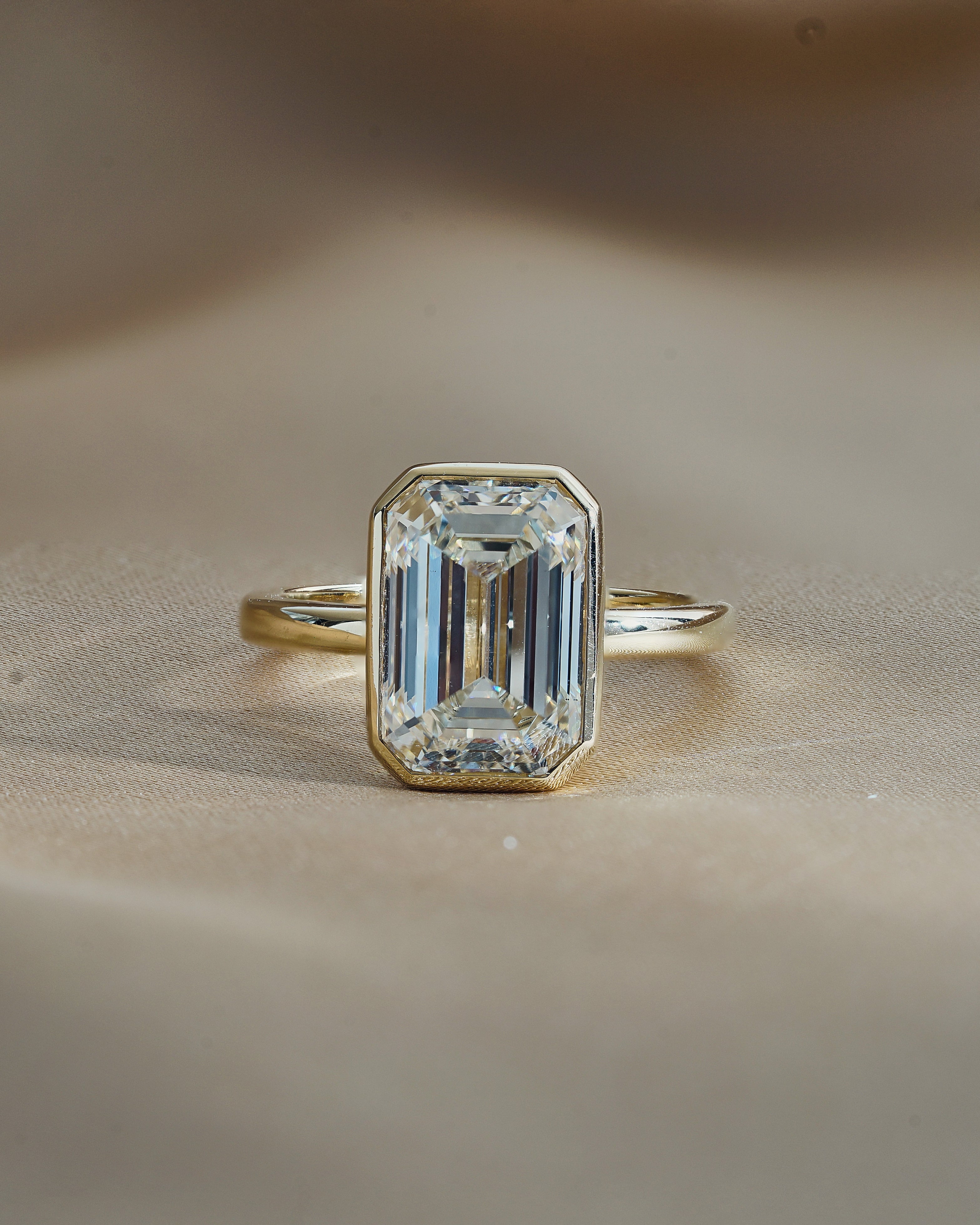 4 Carats Emerald Cut Bezel Set Diamond Ring