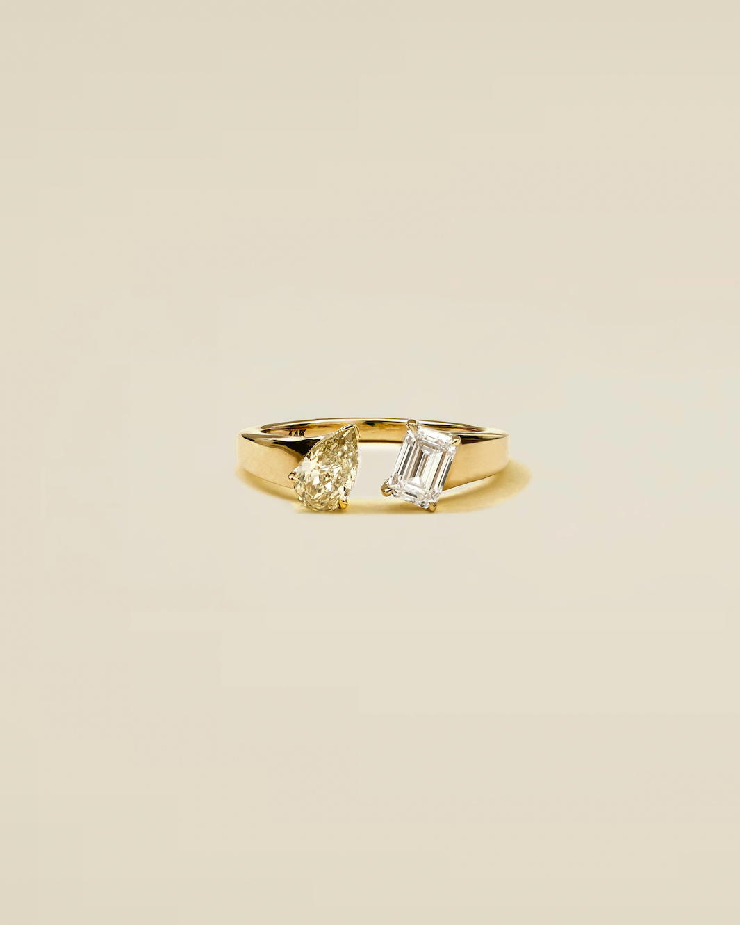 The Reserve 50 Pointer Champagne Pear and 70 Pointer Emerald Cut Diamond with Cigar Band Cuff Ring