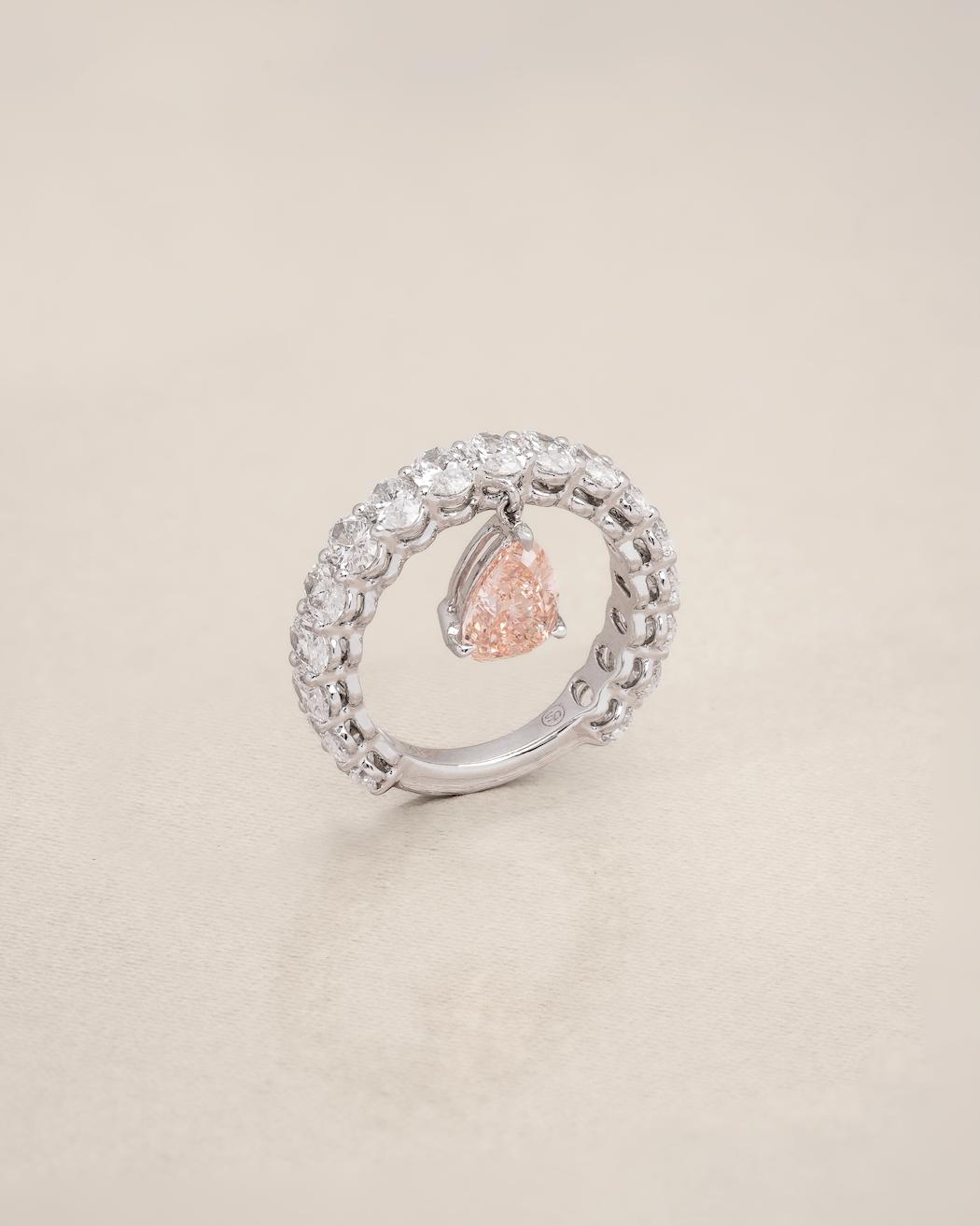 The Reserve II 1 carat Fancy Vivid Pink Pear Cut Diamond with 15 Pointer Oval Half Eternity Ring