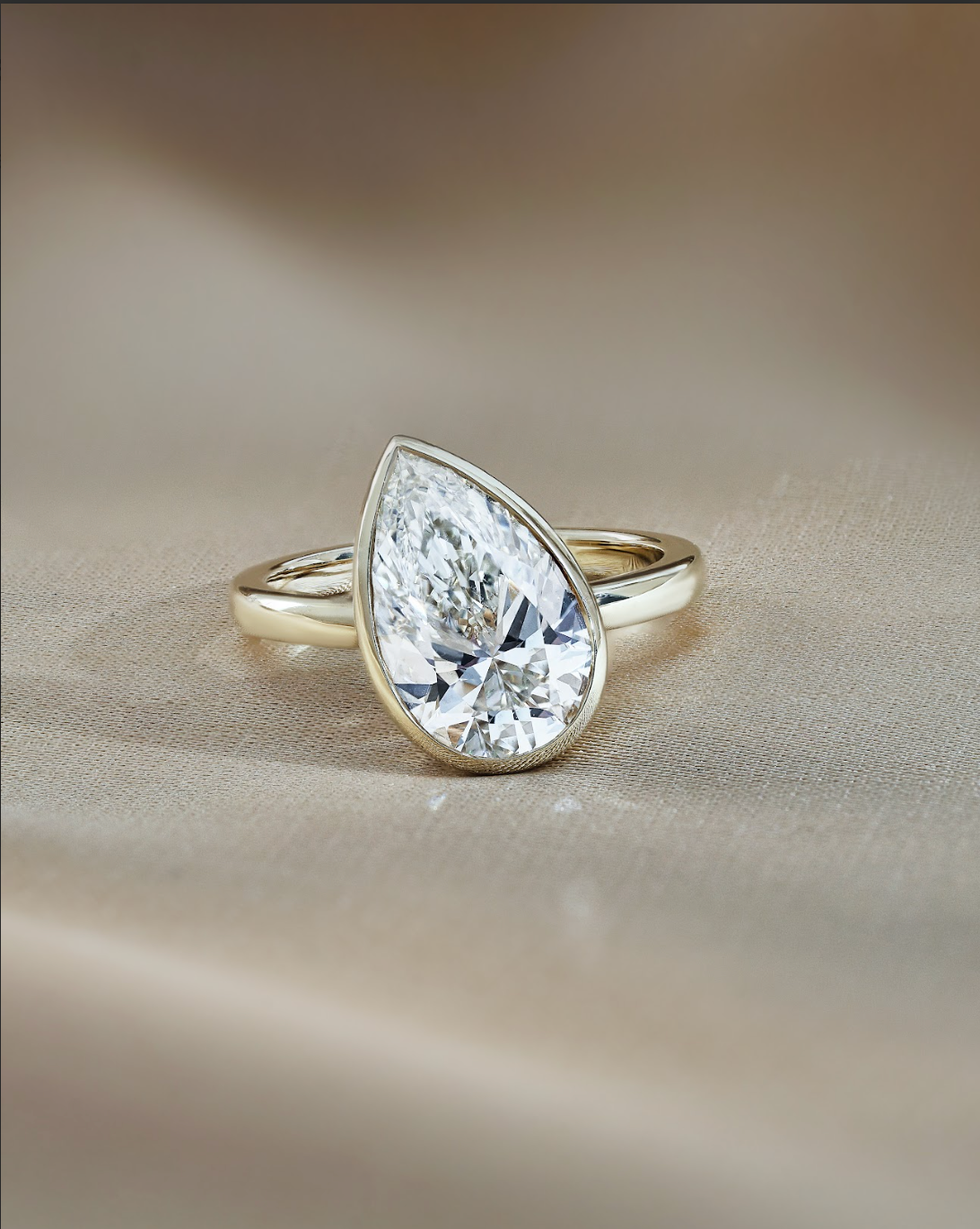 3 carats Pear Cut Diamond Bezel Set Diamond Ring