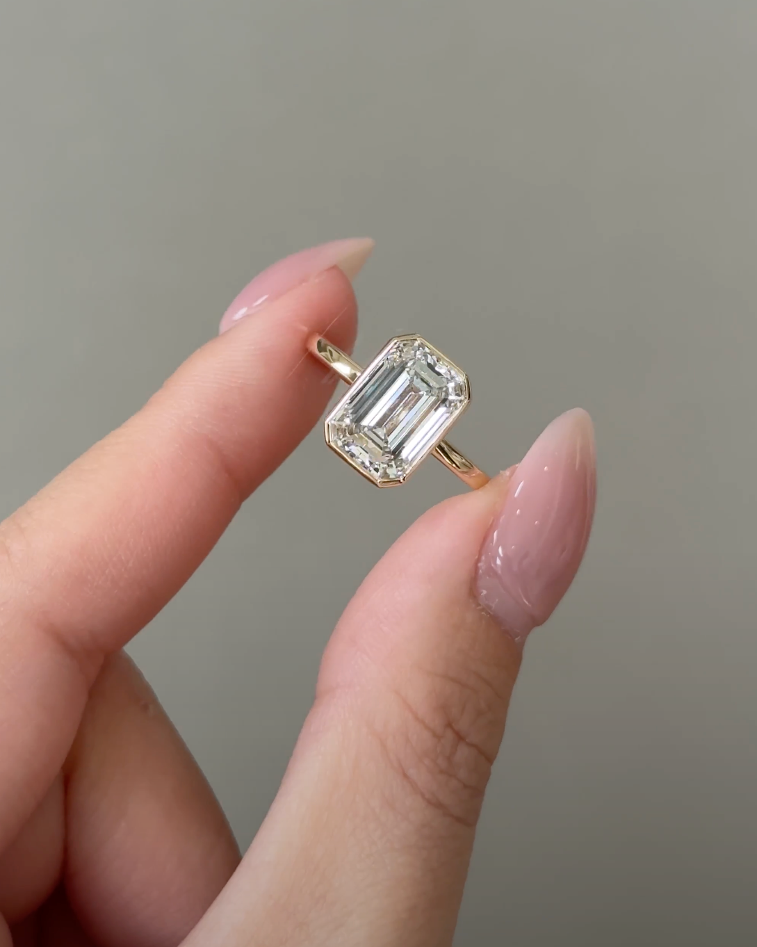 4 Carats Emerald Cut Bezel Set Diamond Ring