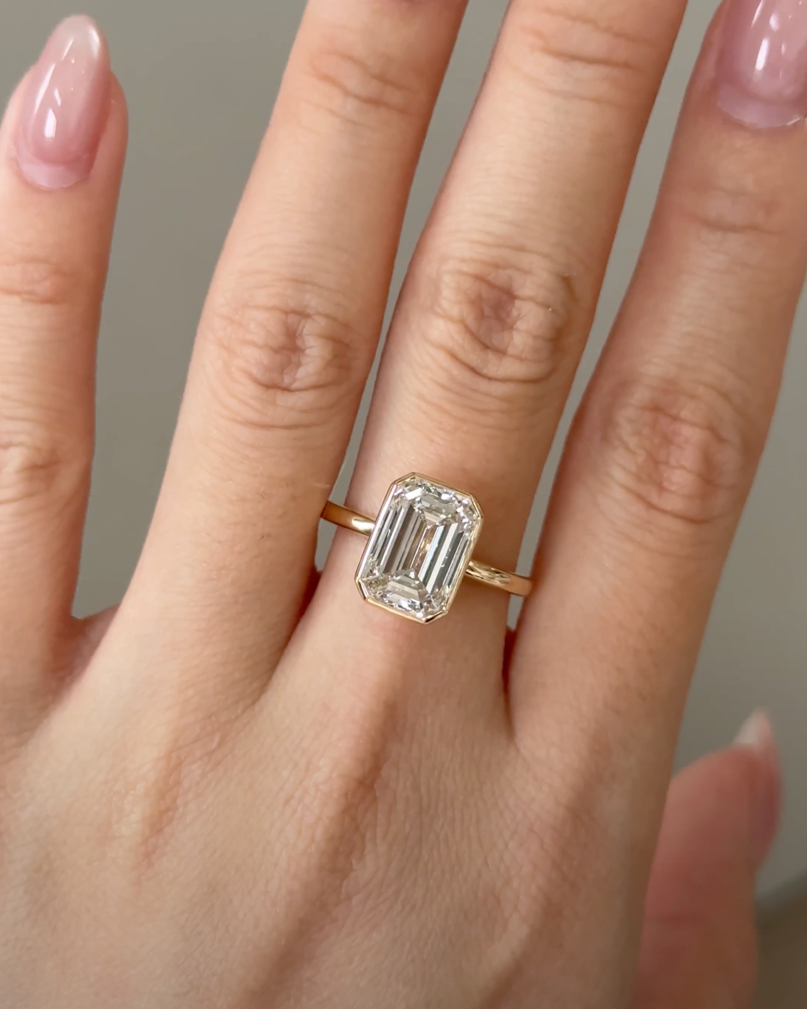 4 Carats Emerald Cut Bezel Set Diamond Ring